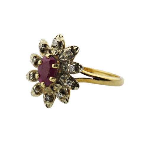 42 - A vintage French gold, ruby and diamond oval flower-head cluster ring, centred with an oval mixed-cu... 