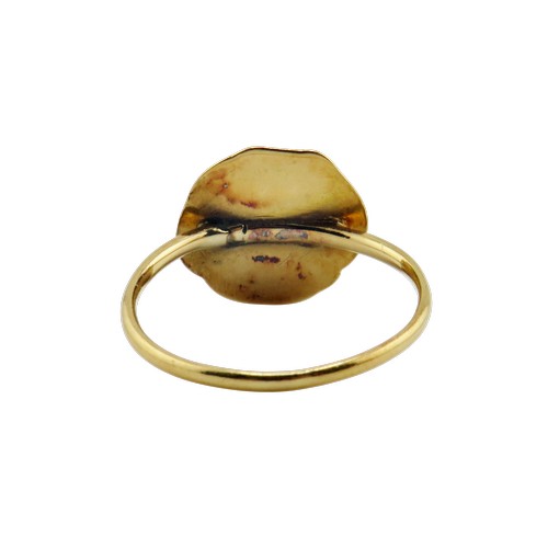 44 - An Art Nouveau French gold 'medallion' ring, the round panel in the form of a winsome female profile... 