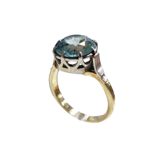 48 - A vintage gold and blue zircon single stone ring, the zircon-cut stone approx. 10mm diameter, claw s... 