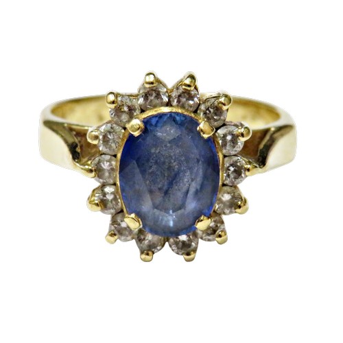 49 - A vintage Continental sapphire and diamond oval cluster ring, centred with a pale-blue oval mixed-cu... 