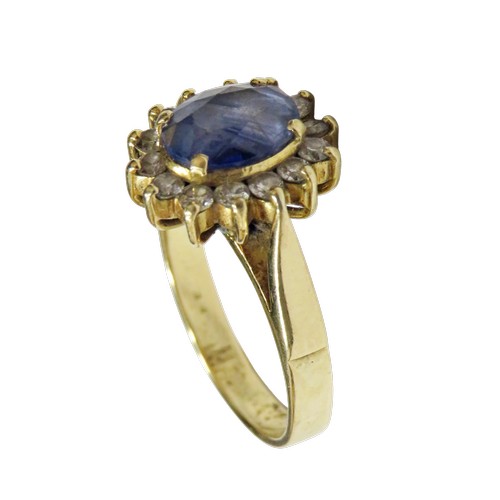 49 - A vintage Continental sapphire and diamond oval cluster ring, centred with a pale-blue oval mixed-cu... 