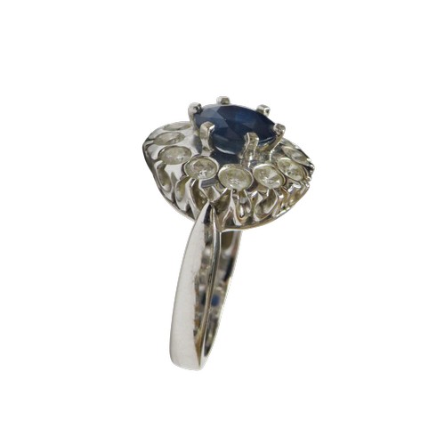 50 - An 18ct white gold, sapphire and diamond cluster ring, centred with a round mixed-cut sapphire appro... 