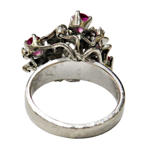 51 - A vintage ruby and diamond abstract floral cluster ring, in the form of leaves and flower-heads in a... 