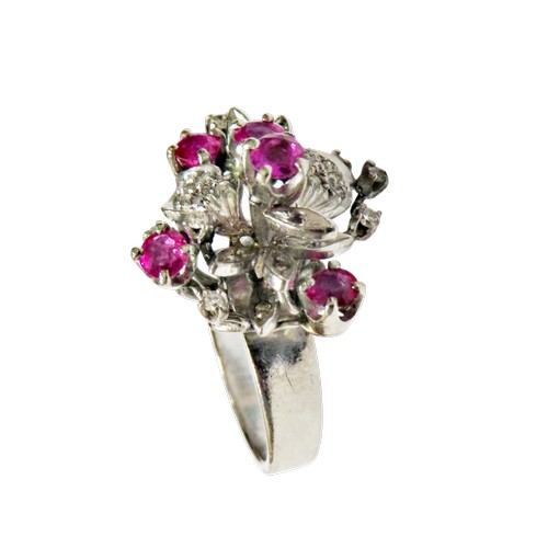 51 - A vintage ruby and diamond abstract floral cluster ring, in the form of leaves and flower-heads in a... 