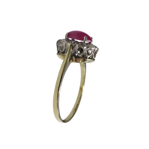 53 - A vintage 9ct gold, synthetic star ruby and diamond oval cluster ring,  the centre stone claw set wi... 