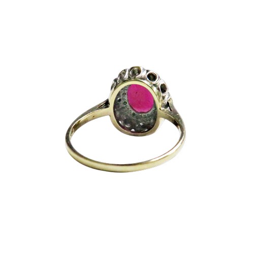 53 - A vintage 9ct gold, synthetic star ruby and diamond oval cluster ring,  the centre stone claw set wi... 