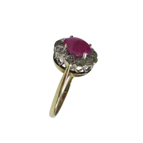 53 - A vintage 9ct gold, synthetic star ruby and diamond oval cluster ring,  the centre stone claw set wi... 