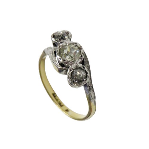 54 - A vintage gold and diamond three stone cross-over ring, the old-cut stones approx. 0.48cts total, il... 