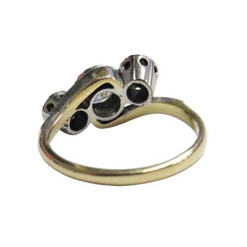 54 - A vintage gold and diamond three stone cross-over ring, the old-cut stones approx. 0.48cts total, il... 