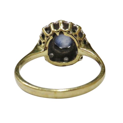 60 - A vintage sapphire and diamond cluster ring circa 1935, centred with a pale-blue round mixed-cut sap... 