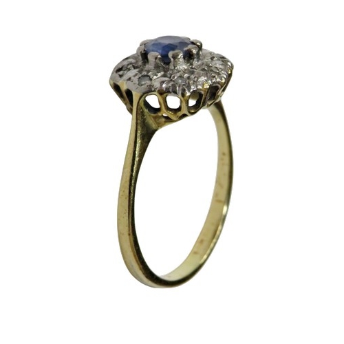 60 - A vintage sapphire and diamond cluster ring circa 1935, centred with a pale-blue round mixed-cut sap... 