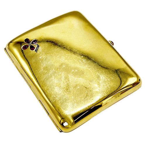 242 - An Edwardian 18ct gold, ruby and diamond concave rectangular cigarette case, with a ruby cabochon th... 