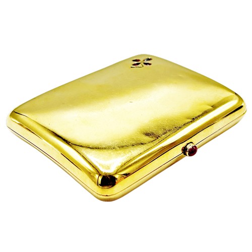 242 - An Edwardian 18ct gold, ruby and diamond concave rectangular cigarette case, with a ruby cabochon th... 