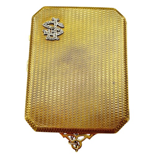 243 - An early 20th century  engine-turned 9ct gold canted-rectangular and bevel-edge purse, the front wit... 