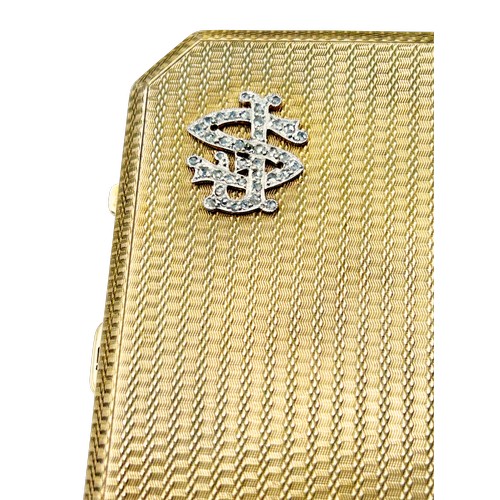 243 - An early 20th century  engine-turned 9ct gold canted-rectangular and bevel-edge purse, the front wit... 