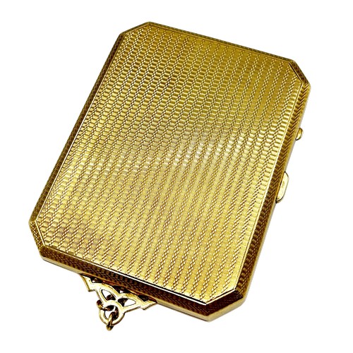 243 - An early 20th century  engine-turned 9ct gold canted-rectangular and bevel-edge purse, the front wit... 