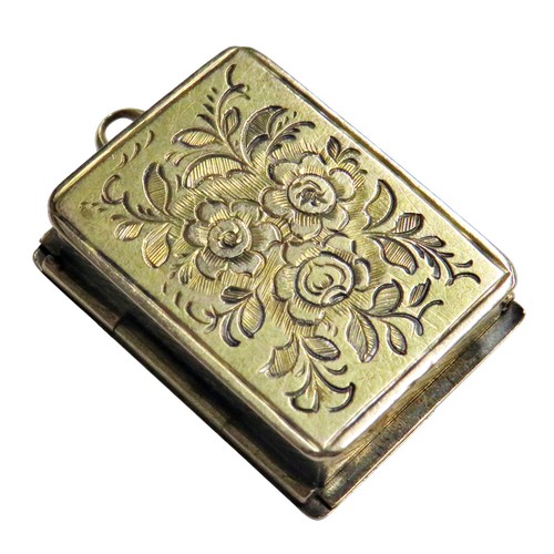 268 - A 19th century gold vesta/or match case in the form of a book, with two hinged covers and engraved w... 