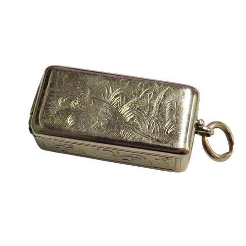 269 - A Continental gold miniature vesta/pill box, the hinged cover engraved with two pheasants in long gr... 