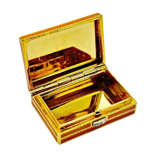 271 - Bvlgari - Roma, a mid/late 20th century Italian gold and orange guilloche enamel pill box with a dia... 