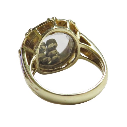 17 - A Continental multi-gem ring resembling a 'happy diamonds' glazed cluster, the shaped-round head enc... 