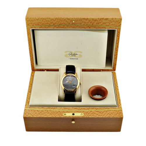 1125 - Glashütte, Senator, Panorama date with moon phase, a gentleman’s 18ct gold wrist watch, signed dark-... 