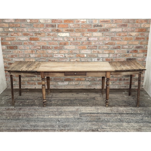 1001 - Antique pine kitchen table with single drawer and additional side extensions, H 71cm x W 130cm (236c... 
