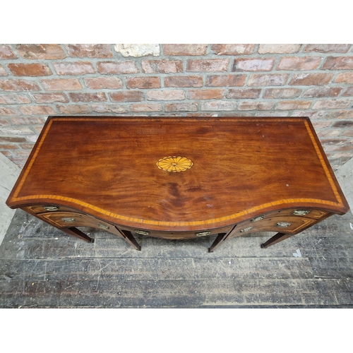 1018 - 19th century mahogany and satinwood inlaid serpentine sideboard fitted with four drawers and a cella... 