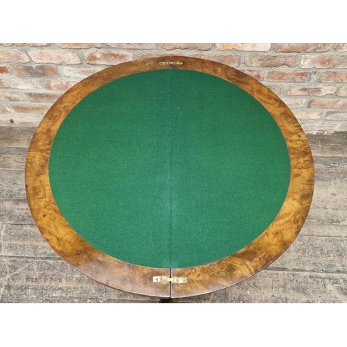 1052 - Victorian walnut fold over top games table with carved detail, raised on a quadruped base, H 70cm x ... 