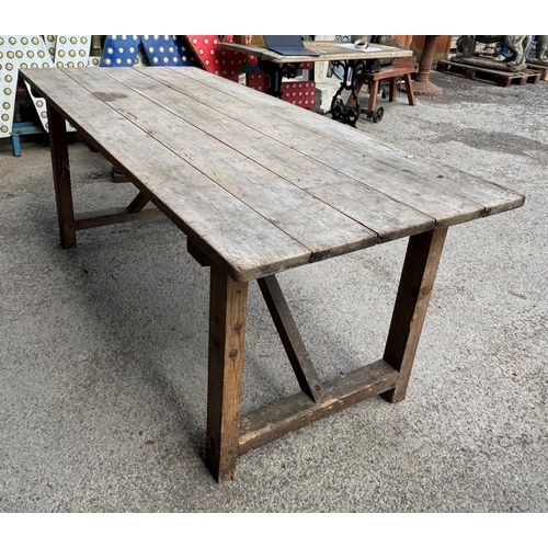 1047 - Vintage pine trestle table with planked top, H 75cm x W 184cm