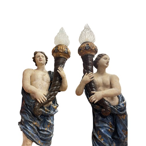 1 - A superb grand scale pair of 17th Century Venetian floor standing painted wood figural torcheres, wi... 