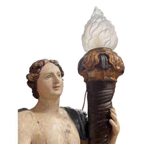 1 - A superb grand scale pair of 17th Century Venetian floor standing painted wood figural torcheres, wi... 