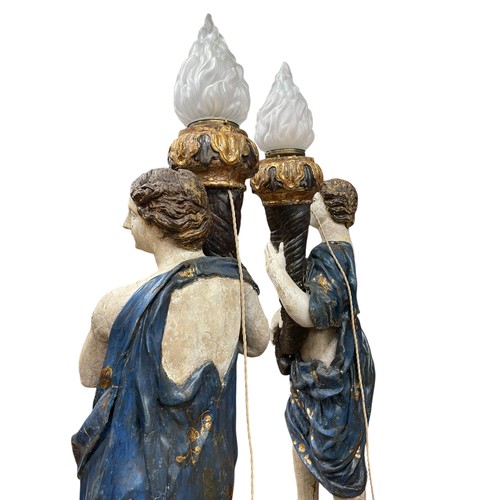1 - A superb grand scale pair of 17th Century Venetian floor standing painted wood figural torcheres, wi... 
