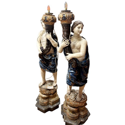1 - A superb grand scale pair of 17th Century Venetian floor standing painted wood figural torcheres, wi... 