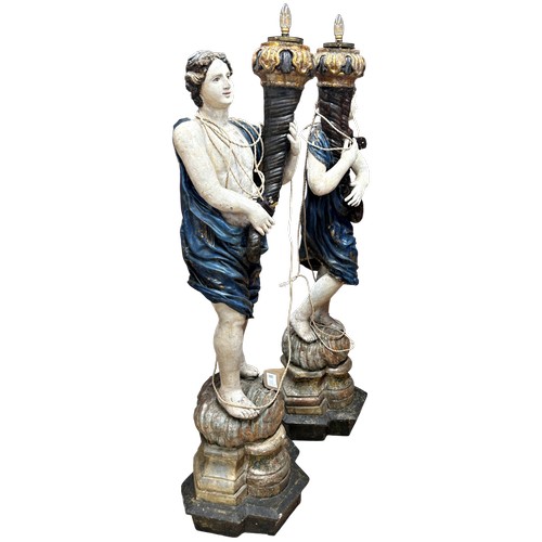 1 - A superb grand scale pair of 17th Century Venetian floor standing painted wood figural torcheres, wi... 