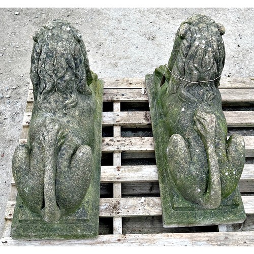 150 - Pair of weathered reconstituted stone recumbent lions with chamfered plinths, H 50cm x W 73cm x D 30... 