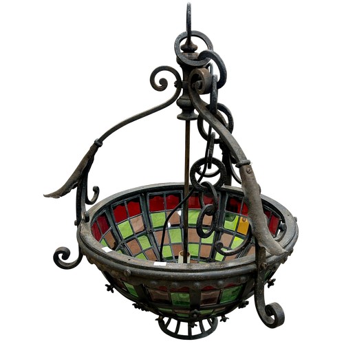 29 - A large late Victorian wrought iron ceiling light with stained glass panels, H 71cm (excluding chain... 