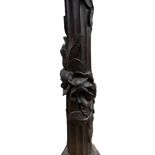 30 - A large early 20th century Swiss Black Forest carved wooden four-arm electrolier, the branches model... 