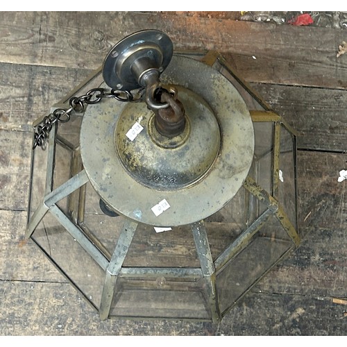 36 - A large octagonal hanging hall lantern with metal frame and perspex panels, with three-light fitting... 