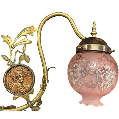 44 - Arts and Crafts brass double-arm ceiling light with figural panels, complete with pink glass acid et... 