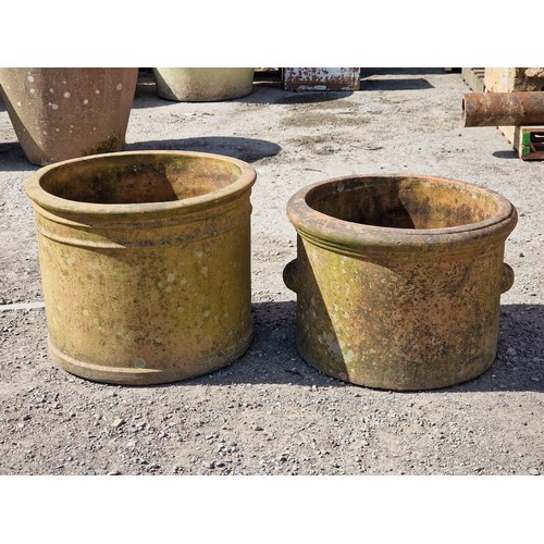 122 - Two weathered terracotta planters of cylindrical form, largest H 40cm x W 51cm (2)
