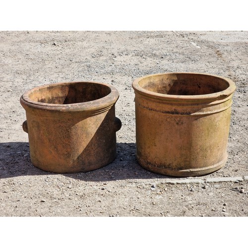 122 - Two weathered terracotta planters of cylindrical form, largest H 40cm x W 51cm (2)