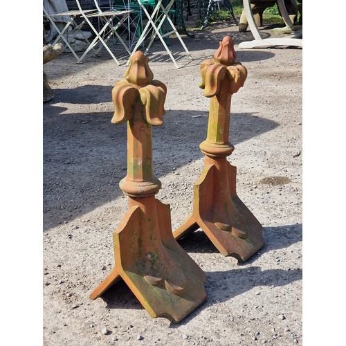 128 - Pair of terracotta roof tiles with fleur-de-lis finials, H 68cm x W 32cm x D 26cm (2) (one finial ha... 