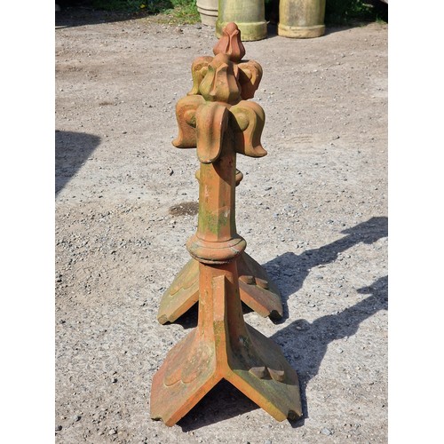 128 - Pair of terracotta roof tiles with fleur-de-lis finials, H 68cm x W 32cm x D 26cm (2) (one finial ha... 