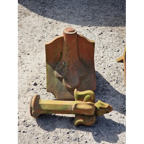 128 - Pair of terracotta roof tiles with fleur-de-lis finials, H 68cm x W 32cm x D 26cm (2) (one finial ha... 