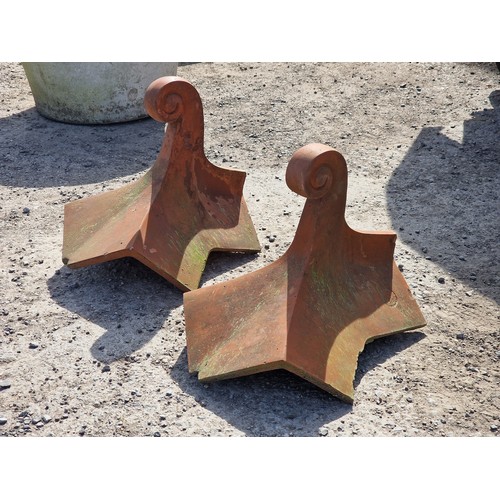 129 - Pair of terracotta roof tiles with scrolled finials, stamped Bridgwater, H 45cm x W 54cm x D 48cm (2... 