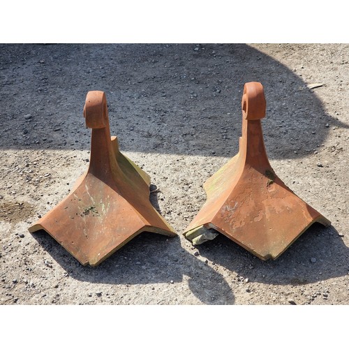 130 - Pair of terracotta roof tiles with scrolled finials, stamped Bridgwater, H 45cm x W 54cm x D 48cm (2... 