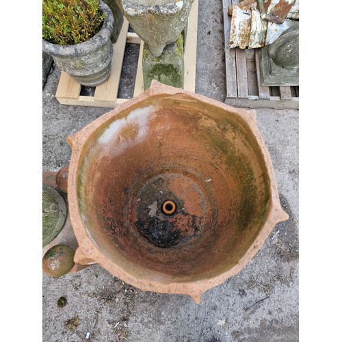 131 - Pair of two sectional terracotta urns with textured roundels and incised detail,