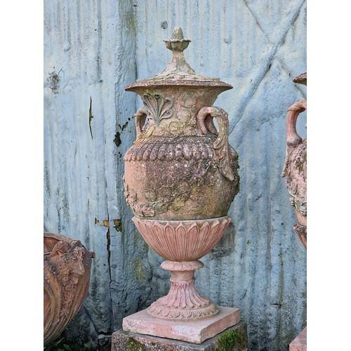 136 - Pair of large 20th century composite terracotta lidded garden urns with foliate and grape vine relie... 