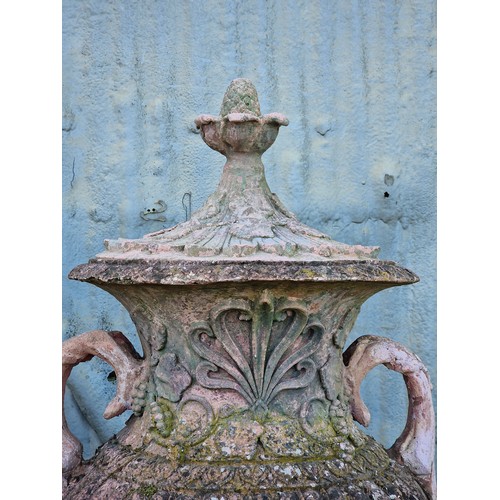 136 - Pair of large 20th century composite terracotta lidded garden urns with foliate and grape vine relie... 