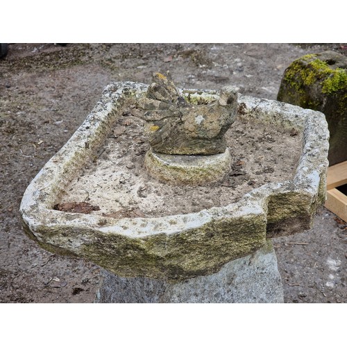 149 - Weathered rustic natural stone bird bath with composite bird decoration, H 71cm x W 60cm x D 64cm